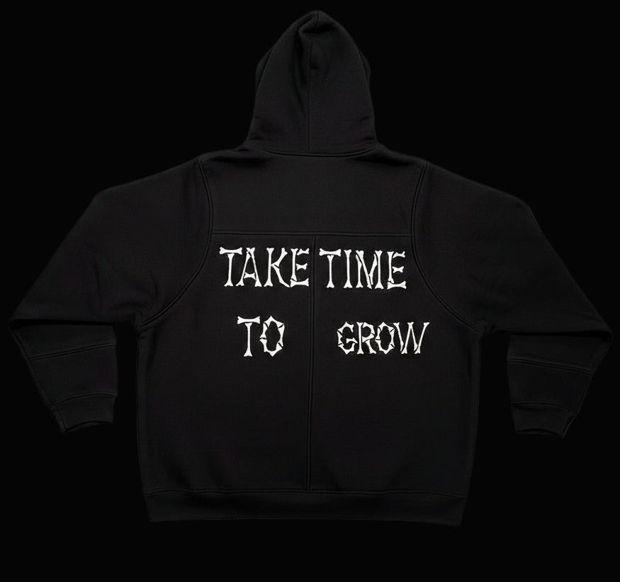 Black hoodie with 'Take Time To Grow' text on back