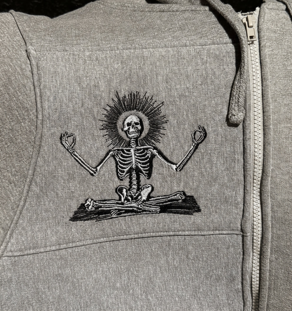 Gray hoodie with a skeleton design on the chest
